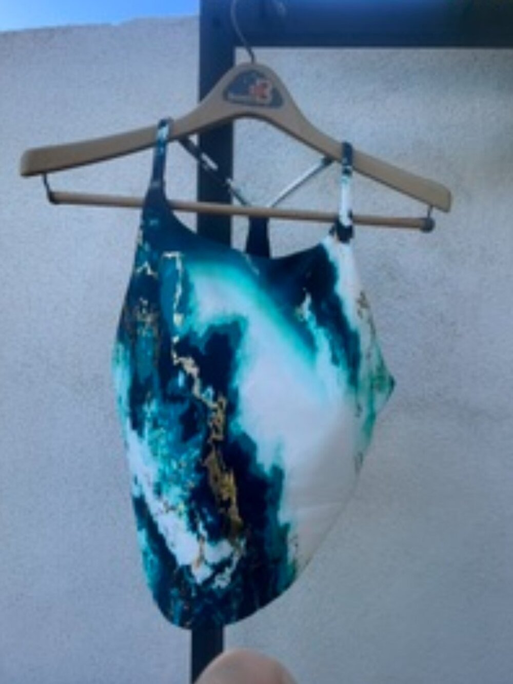 Old Navy teal, black, and gold marbled print sports bra in a Large